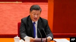 Chinese President Xi Jinping delivers a speech at an event commemorating the 110th anniversary of Xinhai Revolution at the Great Hall of the People in Beijing, Oct. 9, 2021.
