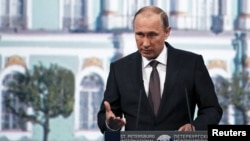 FILE - Russian President Vladimir Putin speaks during a session of the St. Petersburg International Economic Forum 2015, St. Petersburg, Russia, June 19, 2015.