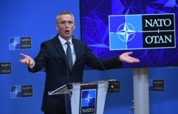 NATO Secretary General Jens Stoltenberg gestures as he talks during a press conference at the NATO headquarters in Brussels, Jan. 7, 2022.
