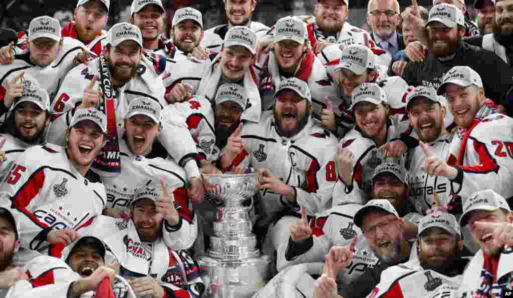 Members of the Washington Capitals pose with the Stanley Cup after the Capitals defeated the Golden Knights 4-3 in Game 5 of the NHL hockey Stanley Cup Finals, June 7, 2018, in Las Vegas.