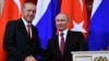 FILE - Russian President Vladimir Putin, right, shakes hands with Turkey's President Recep Tayyip Erdogan after their joint news conference following the talks in the Kremlin in Moscow, Russia, Jan. 23, 2019. 