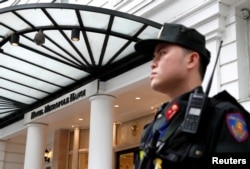 A police officer stands outside the Metropole Hanoi hotel ahead of the North Korea-U.S. summit in Hanoi, Vietnam, Feb. 25, 2019.