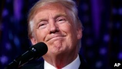 President-elect Donald Trump smiles as he arrives to speak at an election night rally, Wednesday, Nov. 9, 2016, in New York. 