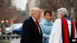 Rev. Luis Leon greets President-elect Donald Trump and his wife Melania as they arrive for a church service at St. John’s Episcopal Church across from the White House in Washington, Jan. 20, 2017, on Donald Trump's inauguration day.