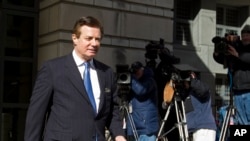 FILE - Paul Manafort, President Donald Trump's former campaign chairman, leaves the federal courthouse after his hearing in Washington, Feb. 28, 2018.