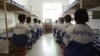 Falun Gong practitioners watch a video about a solar eclipse, part of deprogramming efforts enforced at the Masanjia Reeducation-through-labor camp in northeast China's Liaoning province. (file photo)