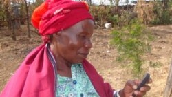 A farmer in Kenya uses the mobile phone registration system