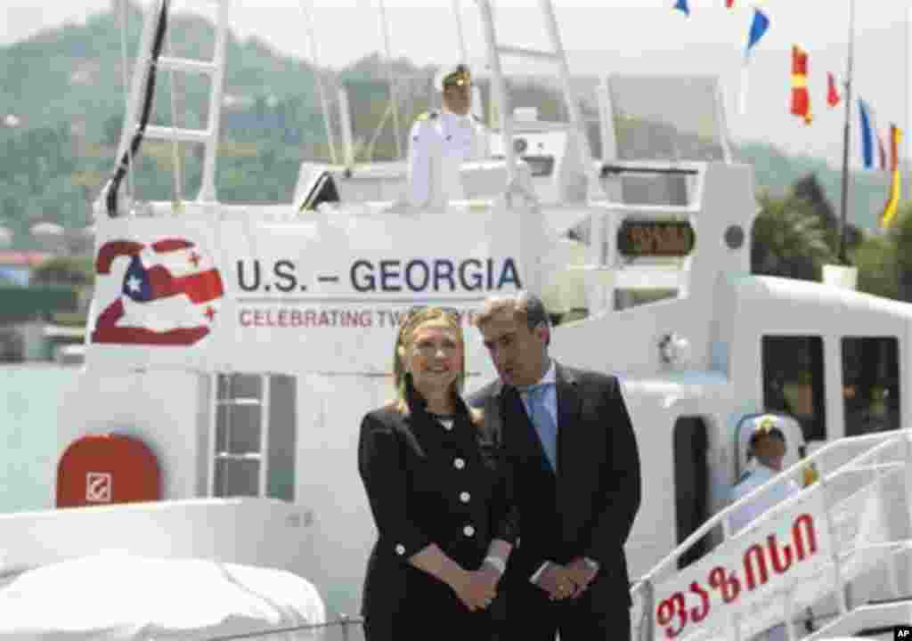 US Secretary of State Hillary Rodham Clinton and Georgian Prime Minister Nika Gilauri attend a Coast Guard ship commissioning ceremony at the passenger terminal wharf in Batumi, Georgia Tuesday June 5 2012. The Soviet-designed boat, which will patrol the