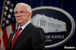 U.S. Attorney General Jeff Sessions stands during a news conference to discuss "efforts to reduce violent crime" at the Department of Justice in Washington, Dec. 15, 2017.