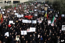 Iranian protesters chant slogans at a rally in Tehran, Iran, Dec. 30, 2017.