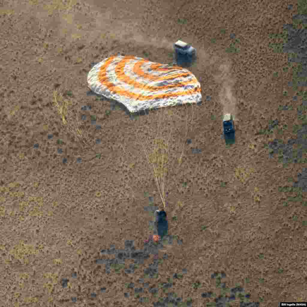 The Soyuz MS-12 spacecraft is seen as it lands in a remote area near the town of Zhezkazgan, Kazakhstan, with Expedition 60 crew members Nick Hague of NASA and Alexey Ovchinin of Roscosmos, along with visiting astronaut Hazzaa Ali Almansoori of the United Arab Emirates.