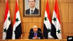 In this photo released by the Syrian official news agency SANA, Syrian Foreign Minister Walid al-Moallem speaks during a press conference in Damascus, Syria, May 8, 2017.