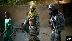 Malian soldiers patrol the streets of Gao, northern Mali, February 5, 2013. 