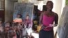 Rebecca Kamara teaches children in Anne-Marie Caulkner's home in Freetown, Sierra Leone, where schools have long been closed because of the Ebola outbreak, Feb. 26, 2015. (Credit: Nina DeVries/VOA)
