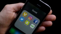 FILE: Some social media apps on a smartphone help by an Associated Press reporter in San Francisco, CA.