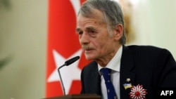 FILE - Prominent Crimean Turkish Tatar political leader and member of the Ukrainian parliament Mustafa Dzhemilev, aka "Kirimoglu", delivers a speech after receiving Turkey's Order of The Republic by the Turkish president during a ceremony in Ankara, April 15, 2014.