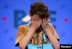 Daniel Larsen, 13, of Bloomington, Indiana, struggles during the 2017 Scripps National Spelling Bee at National Harbor in Oxon Hill, Md., May 31, 2017.