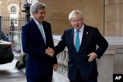 FILE - US Secretary of State John Kerry (L) is greeted by British Foreign Secretary Boris Johnson ahead of a meeting on the situation in Syria, at Lancaster House in London, Sunday Oct. 16, 2016.