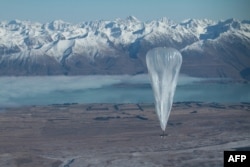 FILE - This handout photo taken on June 15, 2013, and received from Google on June 16 shows a Project Loon high-altitude balloon sailing over Tekapo in southern New Zealand after its launch.