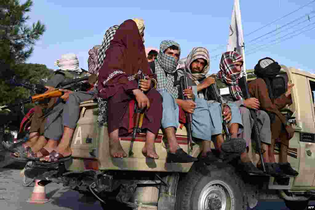 Taliban fighters in a vehicle patrol the streets of Kabul, Afghanistan.