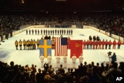 U.S., Swedish, and Soviet teams lined up to receive their Olympic gold, bronze, and silver medals, Lake Placid, N.Y., February 24, 1980.