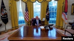 President Donald Trump gestures during an interview with Reuters at the White House in Washington, Jan. 17, 2018. 