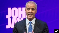 FILE - candidate U.S. Rep. Sean Patrick Maloney stands at the podium during a debate by the Democratic candidates for New York State Attorney General at John Jay College of Criminal Justice in New York.
