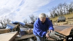 Margie Sisemore cleans after a tornado destroyed several homes in the small town of Cincinnati, Arkansas. That tornado was among 1,600 that crisscrossed the US in 2011.