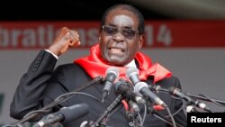 Zimbabwe President Robert Mugabe addresses supporters in Marondera about 80km ( 50 miles) east of the capital Harare, Feb. 23, 2014. 