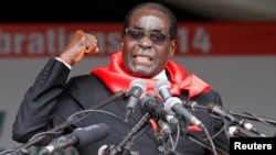 FILE: Zimbabwe President Robert Mugabe addresses supporters during celebrations to mark his 90th birthday in Marondera about 80km ( 50 miles) east of the capital Harare, Feb. 23, 2014. Mugabe turned 90 on February 21. 