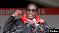Zimbabwe President Robert Mugabe addresses supporters during celebrations to mark his 90th birthday in Marondera about 80km ( 50 miles) east of the capital Harare, Feb. 23, 2014. Mugabe turned 90 on February 21. 