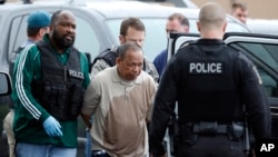 Police take Eulalio Tordil, 62, a suspect in three fatal shootings in the Washington, D.C., area, into custody in Silver Spring, Md., May 6, 2016. 