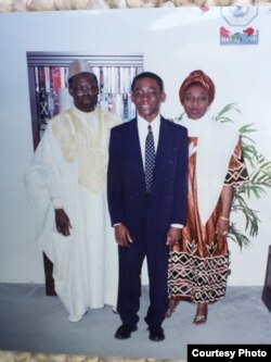 A photo of Bambadjan Bamba as a young boy, with his parents. (B. Bamba)