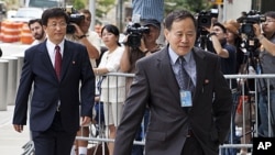 North Korean diplomats return to the Ronald H. Brown United States Mission to the United Nations, July 28, 2011, in New York