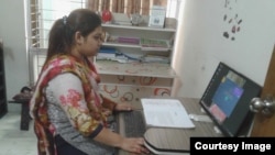 Working lady on computer at Narinibash.