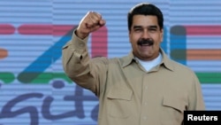 Venezuela's President Nicolas Maduro gestures during a meeting with supporters in Caracas, March 31, 2017.