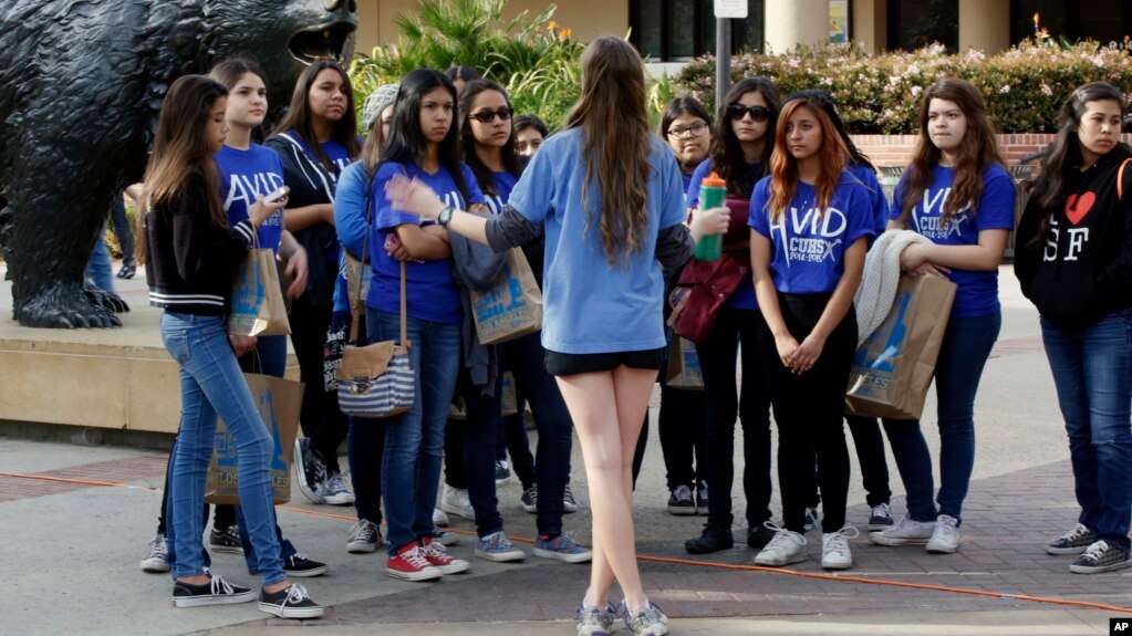 FILE - High school students visit UCLA in 2015. Most colleges permitted visitors this year. (AP Photo/Damian Dovarganes, File)