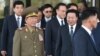 North Korean Hwang Pyong-So (2L), director of the military's General Political Bureau, the top military post in North Korea, walks with other officials as they leave a meeting with South Korean Unification Minister Ryoo Kihl-Jae, on the sidelines of the ongoing Asian Games, Oct. 4, 2014.