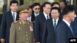 North Korean Hwang Pyong-So (2L), director of the military's General Political Bureau, the top military post in North Korea, walks with other officials as they leave a meeting with South Korean Unification Minister Ryoo Kihl-Jae, on the sidelines of the ongoing Asian Games, Oct. 4, 2014.