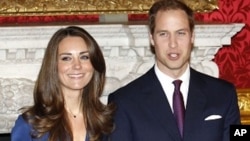 Britain's Prince William and his fiancee Kate Middleton pose for a photograph in St. James's Palace in central London, November 17, 2011