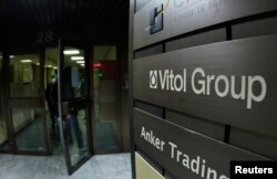 FILE - A sign is pictured in front of Vitol Group trading commodities company building in Geneva, Oct. 4, 2011.