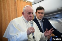 Pope Francis speaks to reporters during the flight from Skopje to Rome, at the end of his apostolic journey to Bulgaria and North Macedonia, May 7, 2019.