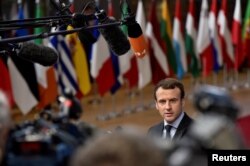 French President Emmanuel Macron arrives to attend the EU summit in Brussels, Belgium, Dec. 14, 2017.