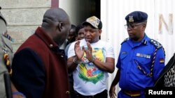 Nairobi's Governor Mike Sonko is escorted by police officers after his arrest, at airport in Nairobi, Kenya. (File)