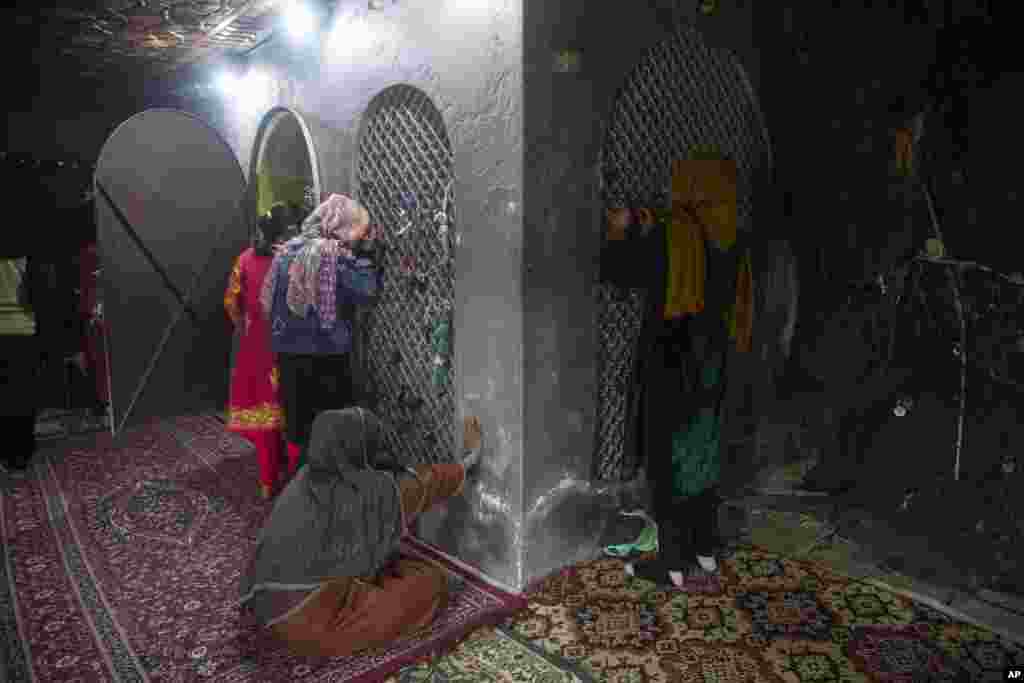Kashmiri Shi&#39;ite Muslims pray inside the shrine of Peer Syed Mehndi during the Persian New Year, in Srinagar, Indian-controlled Kashmir.