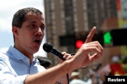 FILE - Venezuelan opposition leader Juan Guaido, whom many nations have recognized as the country's rightful interim ruler, attends a rally against Venezuelan President Nicolas Maduro's government in Caracas, April 6, 2019.