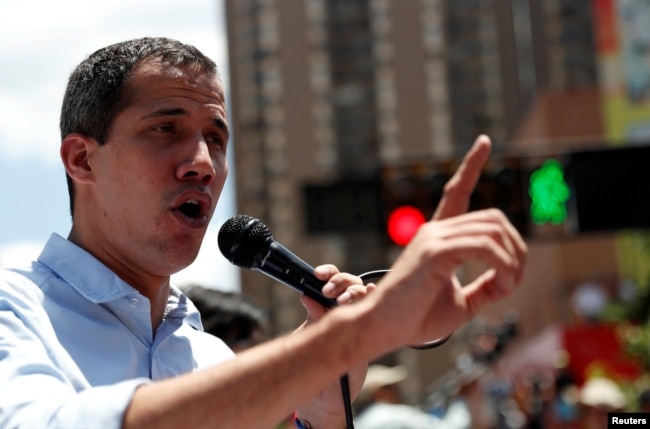 FILE - Venezuelan opposition leader Juan Guaido, whom many nations have recognized as the country's rightful interim ruler, attends a rally against Venezuelan President Nicolas Maduro's government in Caracas, April 6, 2019.