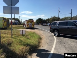 Fire trucks are seen near a Baptist church in Sutherland Springs, Texas, Nov. 5, 2017, in a picture obtained via social media. (MAX MASSEY/KSAT 12)