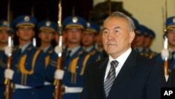 FILE - Kazakstan's President Nursaltan Nazarbaev is shown during a welcoming ceremony in the Great Hall of the People, Beijing, China, Dec. 23, 2002.