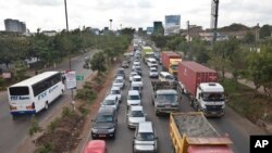 FILE -An April 14, 2015 photo shows drivers in queues of traffic on a highway in downtown Nairobi, Kenya. Taxi operators want Kenya's government to stop ride-sharing app Uber's operations.